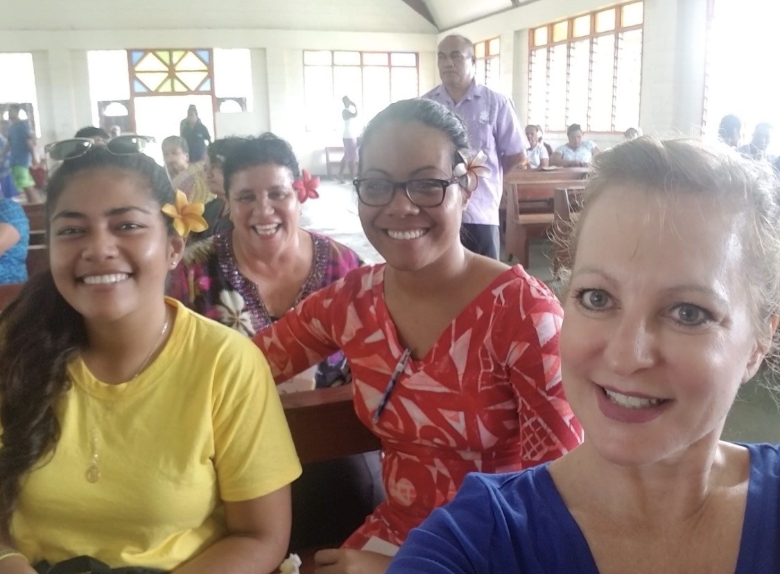 Student Sharon Halter-Day poses with three other individuals in Samoa