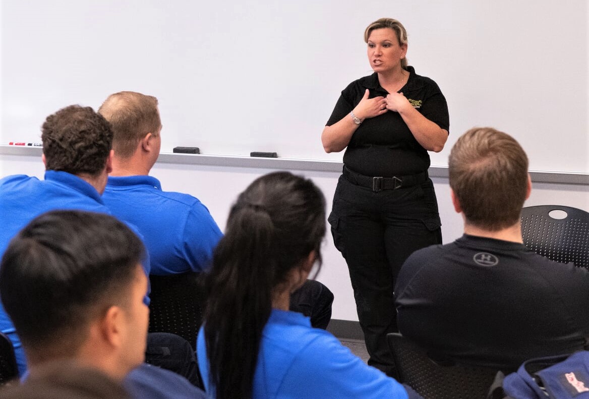 Heather Saenz teaches a group of EMTs