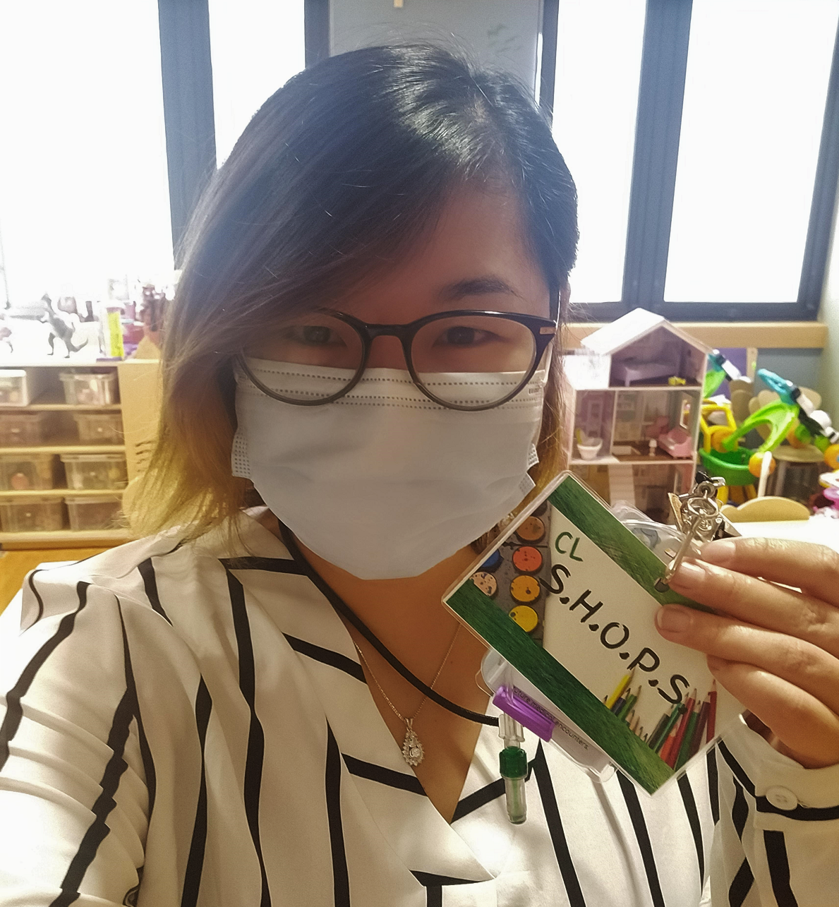 Child Life Specialist MS student Susanna Bun stands in a hospital playroom