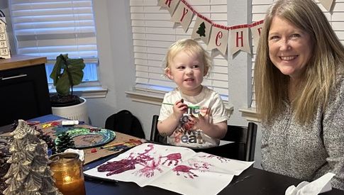Dr. Kimberly Freeman painting with granddaughter