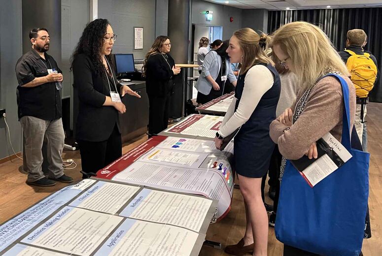 School of Behavioral Health student Kayce Shepard discusses her research poster with attendees during the poster session at the 2026 IFTA World Congress in Bergen, Norway.