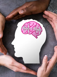 hands surrounding image of brain