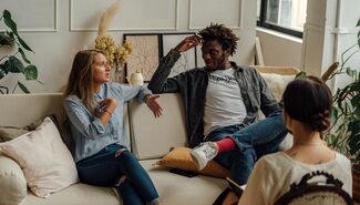 Couple speaking with therapist