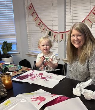 Dr. Kimberly Freeman painting with granddaughter