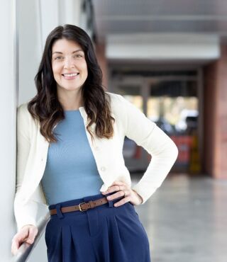 Dr. Andy Tabuenca standing in a hospital hallway