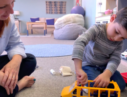 Play therapist engages with a child