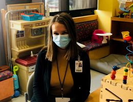 Child Life student Krista Schafer sits in a play room at the children's hospital