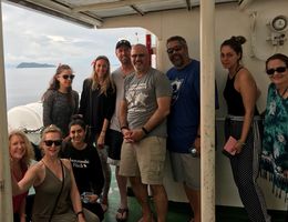 group of students and faculty on boat