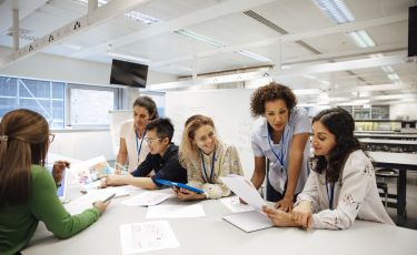 students reviewing document