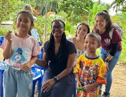Rosie Mejia (back) on a visit to the Ban Tham Suea Community