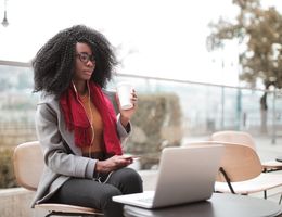 woman using laptop outdoors