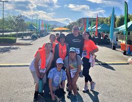 Seven 5K participants pose for a group photo