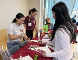 SBH students speak with My Campus participants at an information booth