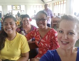 Student Sharon Halter-Day poses with three other individuals in Samoa