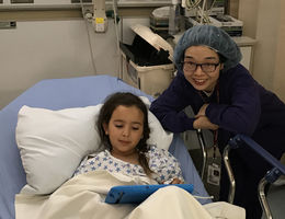 Nancy Wu with a patient in the Children's Hospital
