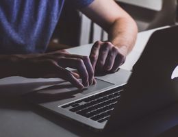 individual using Apple computer