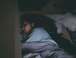 person and cat asleep