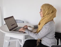 woman using laptop at table